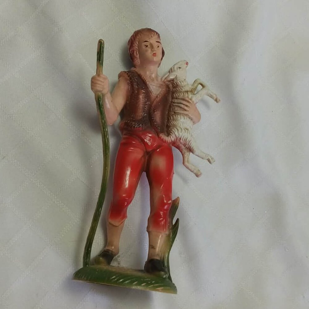 One of the three wise men from the nativity scene/shepherd the nativity scene